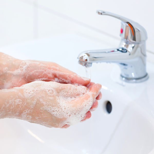 washing of hands with soap under running water. hygiene and cleaning hands.